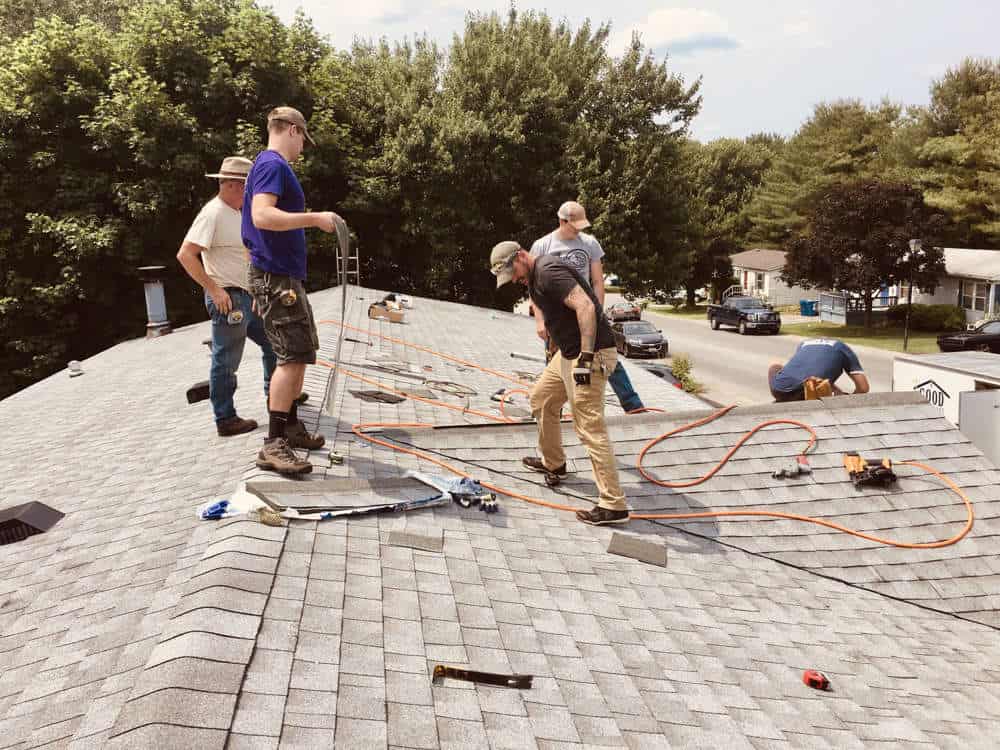 Roofers working on roof