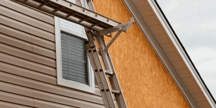 Ladder and Scaffolding leaning on a roof