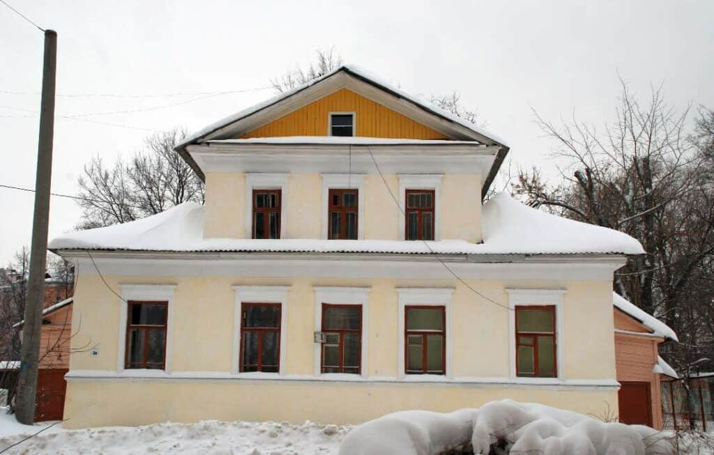 a home with a snowy roof during winter