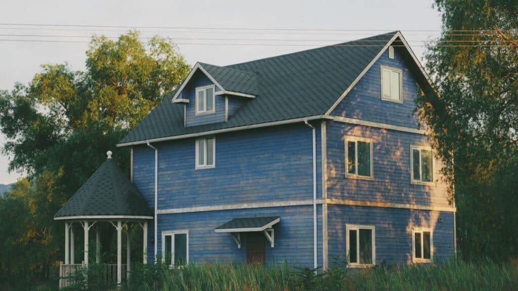 a blue home at sunset