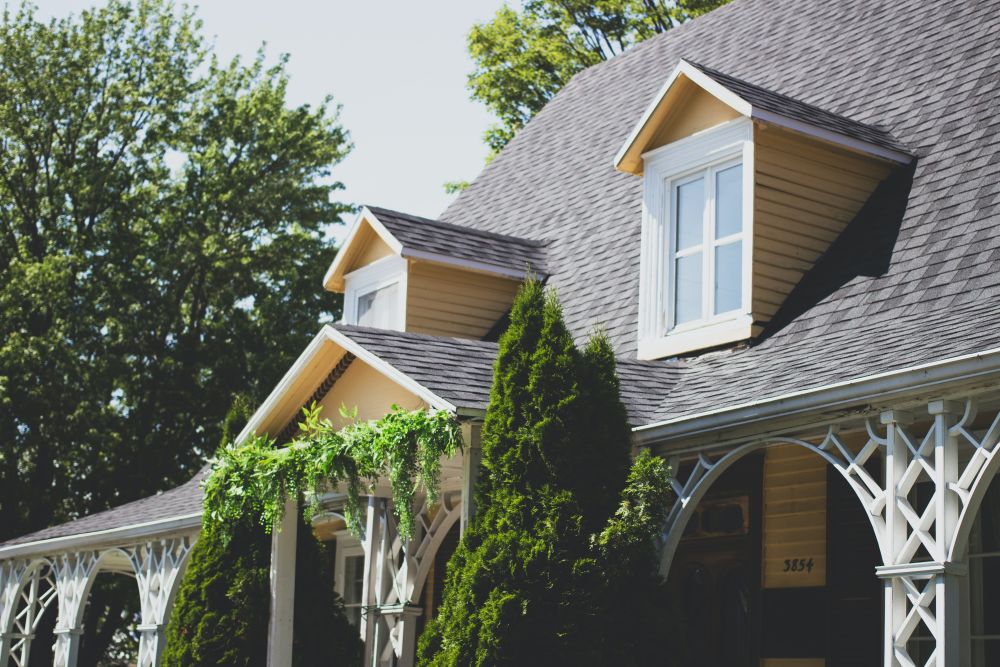 the front of a suburban home with a new roof